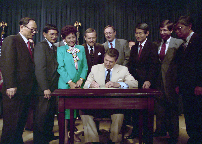 President Ronald Reagan signing the U.S. Civil Liberties Act of 1988, Washington, D.C. (August 10, 1988).